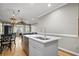 Kitchen island with stainless steel dishwasher and sink overlooking the open living area at 81 Sandbar Ln # 23, Folly Beach, SC 29439