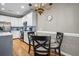 Kitchen and dining area with hardwood floors, modern appliances, and decorative chandelier at 81 Sandbar Ln # 23, Folly Beach, SC 29439