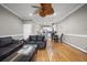 Open-concept living room with hardwood floors, kitchen, and dining area at 81 Sandbar Ln # 23, Folly Beach, SC 29439