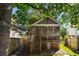 A quaint covered back porch that is accessible from a staircase leading into the backyard at 815 Harbor Pl Dr, Charleston, SC 29412