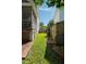 A well-manicured backyard with a brick pathway, lush grass, and tidy landscaping, offering a serene outdoor setting at 815 Harbor Pl Dr, Charleston, SC 29412