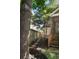 A backyard features stone steps, tidy foliage and natural border that leads to a screened-in porch at 815 Harbor Pl Dr, Charleston, SC 29412