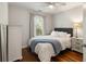 Bedroom featuring a large window, hardwood floors and a bed with a blue blanket at 815 Harbor Pl Dr, Charleston, SC 29412