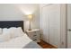 Bedroom with hardwood floors, a nightstand lamp, and closet doors at 815 Harbor Pl Dr, Charleston, SC 29412