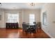 Cozy dining room featuring hardwood floors, modern lighting, and a built in dry bar for entertaining at 815 Harbor Pl Dr, Charleston, SC 29412