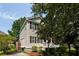 Two-story home with vinyl siding, complemented by manicured landscaping and a side driveway at 815 Harbor Pl Dr, Charleston, SC 29412