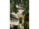 Charming home entrance framed by lush greenery, showcasing a glass-accented front door at 815 Harbor Pl Dr, Charleston, SC 29412