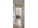 Hallway view looking into bedroom with hardwood floors and large window at 815 Harbor Pl Dr, Charleston, SC 29412