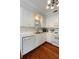 This kitchen features white cabinets with matching appliances and trim, creating a cohesive and modern design at 815 Harbor Pl Dr, Charleston, SC 29412
