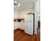 Bright kitchen with ample storage in the white cabinets, hardwood floors and modern appliances offer efficiency at 815 Harbor Pl Dr, Charleston, SC 29412