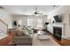 Comfortable living room with a fireplace, ceiling fan, and lots of natural light at 815 Harbor Pl Dr, Charleston, SC 29412
