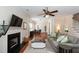 Open-concept living area featuring hardwood floors, a fireplace, and a connecting dining space at 815 Harbor Pl Dr, Charleston, SC 29412