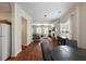 Spacious living area with hardwood flooring, seamlessly connecting to a living room with a fireplace at 815 Harbor Pl Dr, Charleston, SC 29412