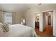 The bedroom features hardwood floors, natural light, and an ensuite bath for a relaxing and private space at 815 Harbor Pl Dr, Charleston, SC 29412
