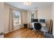 Office featuring hardwood floors, two large windows, and a computer desk at 815 Harbor Pl Dr, Charleston, SC 29412