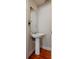 This powder room features a pedestal sink, minimalist design, and classic flooring, ideal for guests at 815 Harbor Pl Dr, Charleston, SC 29412