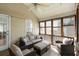 Relaxing sunroom with neutral tones, wicker furniture, and plenty of natural light for a cozy indoor-outdoor feel at 815 Harbor Pl Dr, Charleston, SC 29412