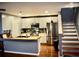 Modern kitchen features stainless steel appliances, white cabinetry, a butcher block counter and an eat-in area at 9122 Maple Grove Dr, Summerville, SC 29485