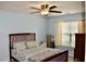 Comfortable main bedroom offers a ceiling fan and a window with natural light at 9122 Maple Grove Dr, Summerville, SC 29485