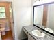 Bright bathroom featuring a granite countertop vanity and tile flooring at 101 Limerick Cir, Summerville, SC 29483