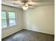 Cozy bedroom featuring a ceiling fan and double window for natural light at 101 Limerick Cir, Summerville, SC 29483