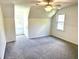 Carpeted bedroom with high ceilings, ceiling fan, and double window at 101 Limerick Cir, Summerville, SC 29483