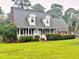 Charming home with a covered porch, dormer windows, and well-maintained landscaping at 101 Limerick Cir, Summerville, SC 29483