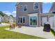 Backyard patio with patio furniture and a grill, offering a cozy outdoor space for relaxation and barbecues at 101 Patterson Ave, Goose Creek, SC 29445