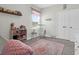Bright Bedroom featuring a rocking chair, books, and charming decor, perfect for a growing Gathering at 101 Patterson Ave, Goose Creek, SC 29445