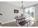 Dining room with a wooden table, bench, and slider to the backyard at 101 Patterson Ave, Goose Creek, SC 29445