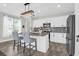 Modern kitchen with an island, granite countertops, stainless steel appliances, and pendant lighting at 101 Patterson Ave, Goose Creek, SC 29445