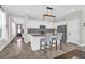 Contemporary kitchen showcasing an island with bar seating, granite counters, and stainless appliances at 101 Patterson Ave, Goose Creek, SC 29445