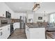 Bright, open kitchen features granite counters, stainless appliances, and a view into the living area at 101 Patterson Ave, Goose Creek, SC 29445