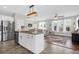 Open-concept kitchen featuring a large island with granite countertops and stainless steel appliances at 101 Patterson Ave, Goose Creek, SC 29445
