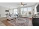 Bright living room with hardwood floors, large windows, and a stylish rug at 101 Patterson Ave, Goose Creek, SC 29445
