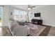 Cozy living room bathed in natural light, featuring hardwood floors and comfortable seating at 101 Patterson Ave, Goose Creek, SC 29445