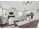 Open concept living space with white kitchen and stylish furnishings at 101 Patterson Ave, Goose Creek, SC 29445
