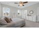 Bright main bedroom with carpet, large windows, and ensuite bathroom at 101 Patterson Ave, Goose Creek, SC 29445