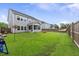 Expansive backyard featuring a screened porch and ample room for recreation at 1017 Saltwater Cir, Johns Island, SC 29455