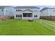 Lush backyard with a covered porch, offering a private and serene outdoor space at 1017 Saltwater Cir, Johns Island, SC 29455