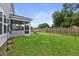 Spacious backyard with a covered porch and plenty of green space for outdoor activities at 1017 Saltwater Cir, Johns Island, SC 29455