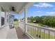 Enjoy outdoor living on this home's balcony with white railings and a comfortable built-in cushioned bench at 1017 Saltwater Cir, Johns Island, SC 29455