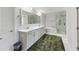 Spacious bathroom featuring tub, glass shower, double vanity, and neutral color palette at 1017 Saltwater Cir, Johns Island, SC 29455