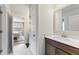 Bright half bathroom featuring wood vanity, white countertops, and modern finishes at 1017 Saltwater Cir, Johns Island, SC 29455