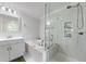 Bright bathroom featuring glass shower, soaking tub, single vanity, and neutral colors at 1017 Saltwater Cir, Johns Island, SC 29455