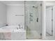 Bright bathroom featuring glass shower, soaking tub, and neutral colors at 1017 Saltwater Cir, Johns Island, SC 29455