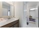 Bright half bathroom featuring wood vanity, white countertops, and modern finishes at 1017 Saltwater Cir, Johns Island, SC 29455