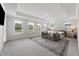 Primary bedroom features sitting area, large bed, and lots of natural light at 1017 Saltwater Cir, Johns Island, SC 29455