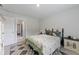Inviting bedroom with neutral walls, plush bedding, and a doorway to another room in the house at 1017 Saltwater Cir, Johns Island, SC 29455