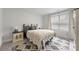Cozy bedroom featuring a patterned rug, comfortable bed, and decorative bedside table at 1017 Saltwater Cir, Johns Island, SC 29455